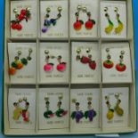 Twelve pairs of novelty hand painted fruit 'swing' earrings