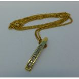 A 9ct gold and diamond pendant on a 9ct gold chain, 4.