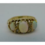 An 18ct gold, opal and diamond ring, 3.