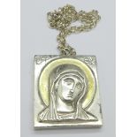 A large silver religious pendant and chain marked Ag 999,