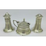 A three piece silver Art Deco cruet,