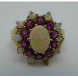 A 9ct gold, opal and ruby cluster ring, lacking one opal, 4.