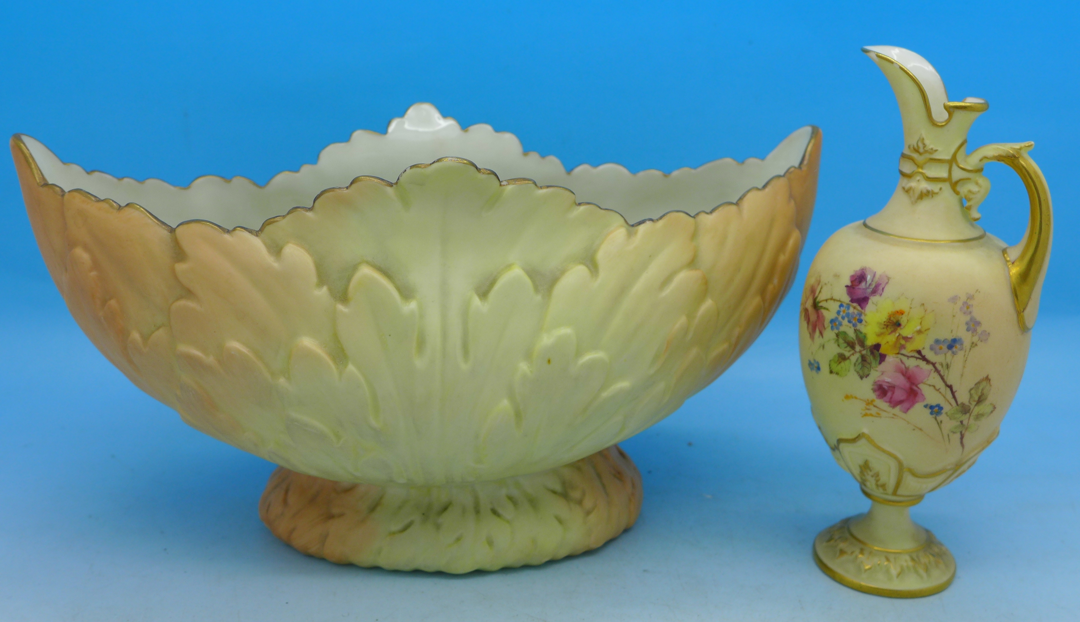 A Royal Worcester ewer, 1581, two chips to rim and a Locke & Co. Worcester vase, ewer 11.