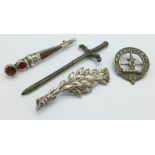 Two Scottish silver brooches including an agate set dirk and two other brooches