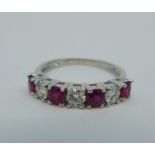 An 18ct gold, ruby and diamond ring, size M½, 2.5g, .88cts ruby and .