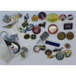 A collection of badges and cufflinks