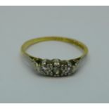 An 18ct gold and platinum set three stone ring, 2.