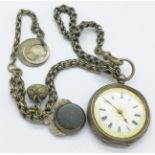 A 935 silver fob watch, lacking glass,