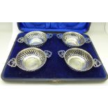 A cased set of four silver dishes, 124g,