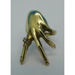 A 9ct gold 'hand' ring, 5.