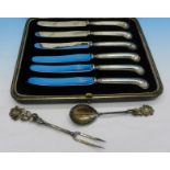 A cased set of six silver pistol-grip handled knives and an 800 silver spoon and fork,