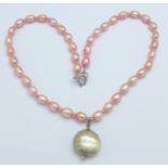 A silver and pink pearl necklace