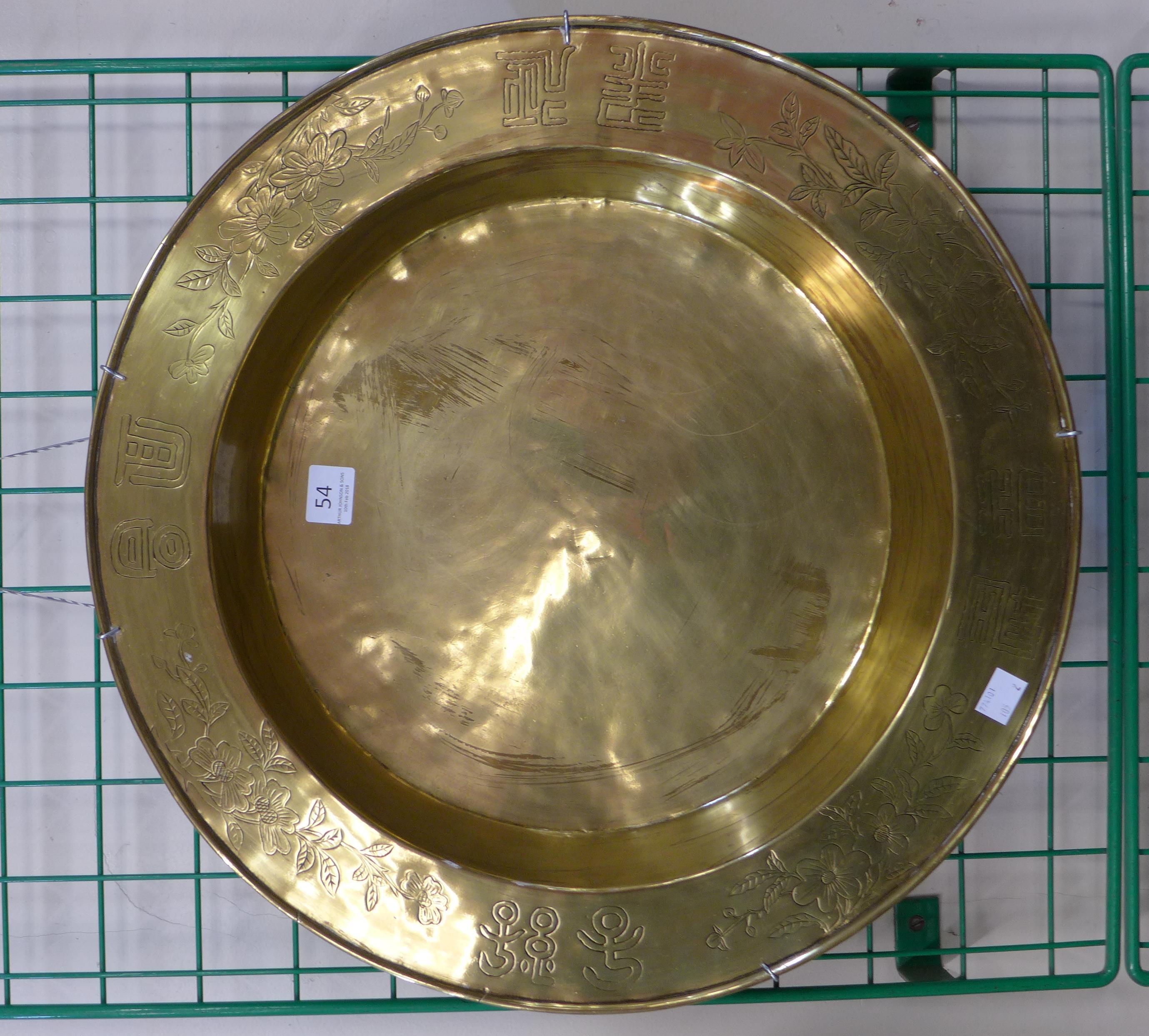 A Chinese brass bowl and Japanese inlaid tray