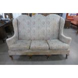 A Queen Anne style walnut and upholstered settee