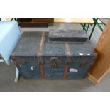 A steamer trunk and small box