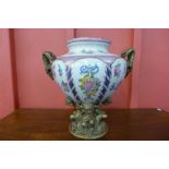 A French porcelain vase painted with roses on a white ground,