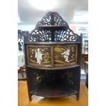 An early 20th Century Chinese hardwood and chinoiserie corner whatnot