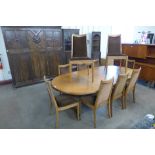 A G-Plan teak extending dining table and ten chairs