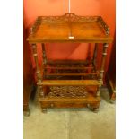 A Victorian walnut Canterbury whatnot