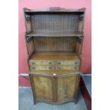 A Regency style mahogany serpentine side cabinet