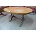 A Victorian walnut oval centre table