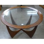 A G-Plan Astro teak and glass topped circular coffee table