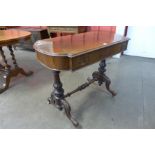 A Victorian rosewood bow-end library table