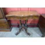 A Victorian burr walnut serpentine card table