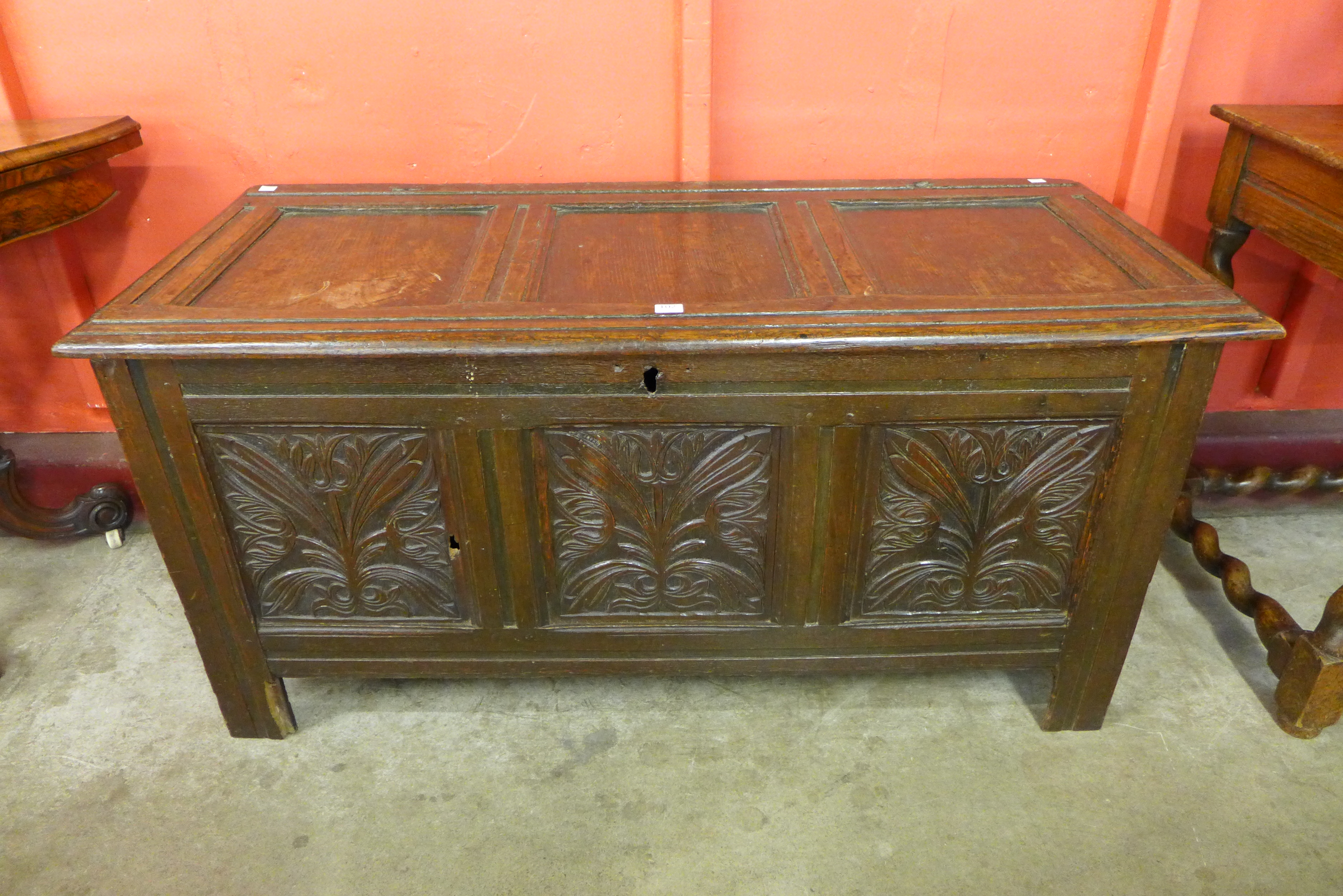 A 17th Century carved oak panelled coffer