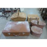Assorted wicker baskets and two brown cases
