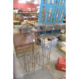 Two wrought iron garden plant climbing frames,