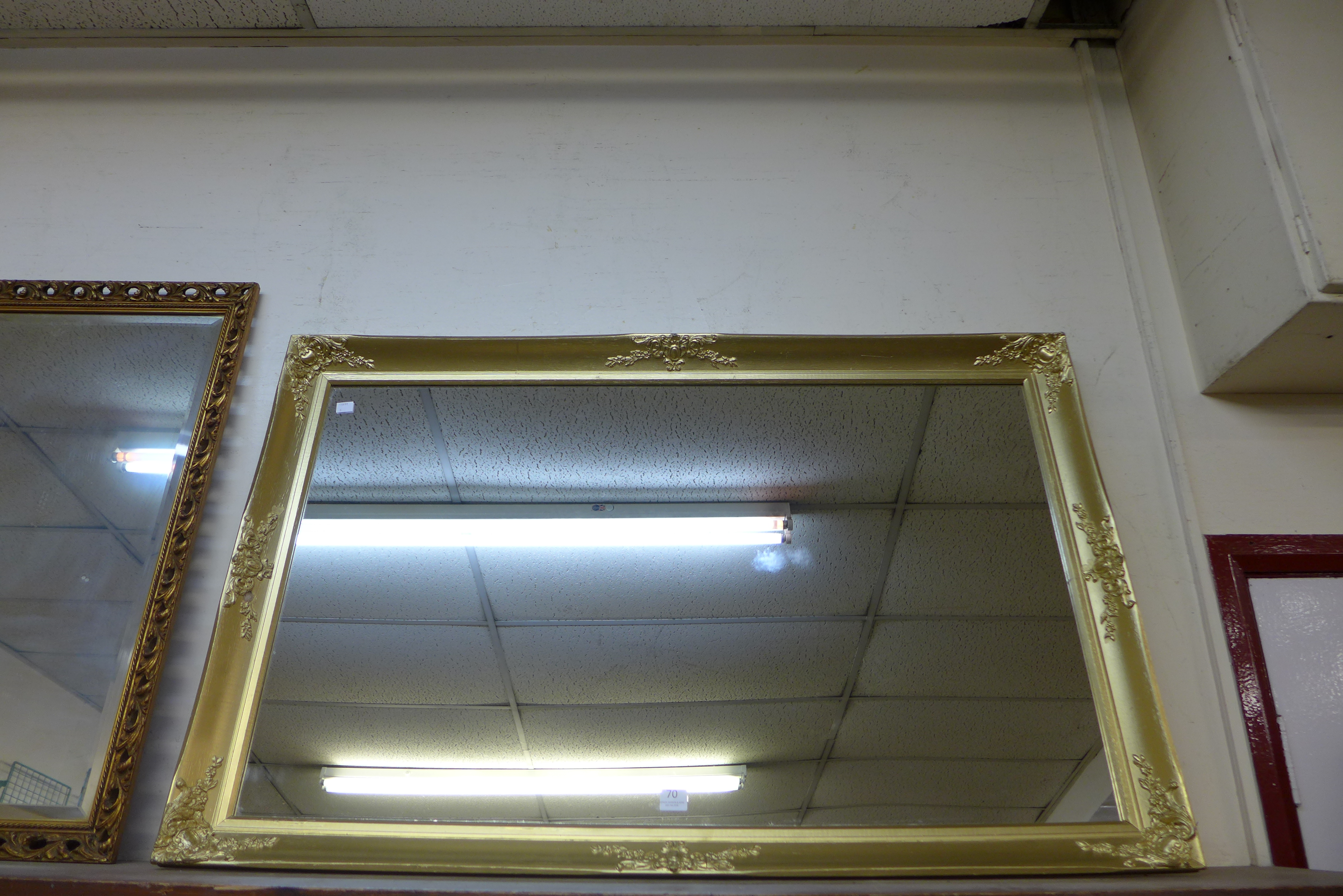 A gilt framed mirror