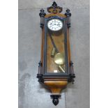 A 19th Century walnut and ebonised two weight Vienna wall clock