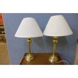 A pair of brass table lamps