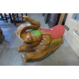 A child's carved wood rocking elephant