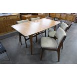 A McIntosh teak extending dining table and four chairs