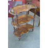 A Victorian burr walnut three tier whatnot