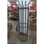 A wrought iron tree frame