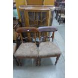 A walnut display cabinet and pair of Victorian mahogany chairs