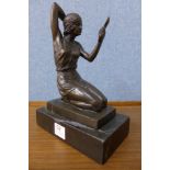 A French style bronze figure of a seated lady holding a mirror