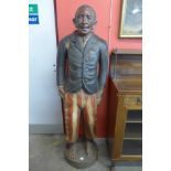 A large carved wood figure of a man