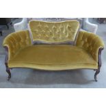 An Edward VII mahogany and upholstered settee