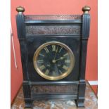 A 19th Century French Belge noir and parcel gilt mantel clock