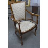 An Edward VII inlaid mahogany elbow chair