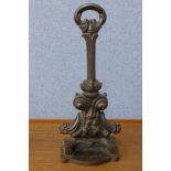 A Victorian cast iron door porter