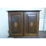 An Edward VII inlaid oak smoker's cabinet