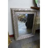 A silver framed mirror