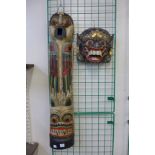 Two Eastern painted wall masks