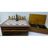 A games compendium and a chess set