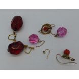 Three pairs of earrings including red faceted with 9ct gold mounts